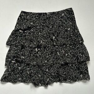 Silk tiered DKNY skirt with floral pattern and side zip. US 4